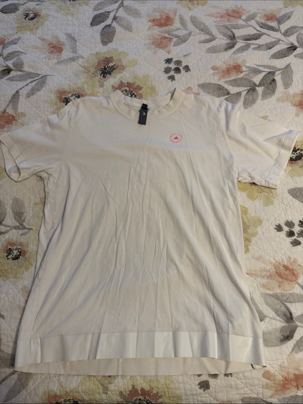 Women’s adidasXStella McCartney white Short Sleeve Crew Tee with Pink Chest Logo